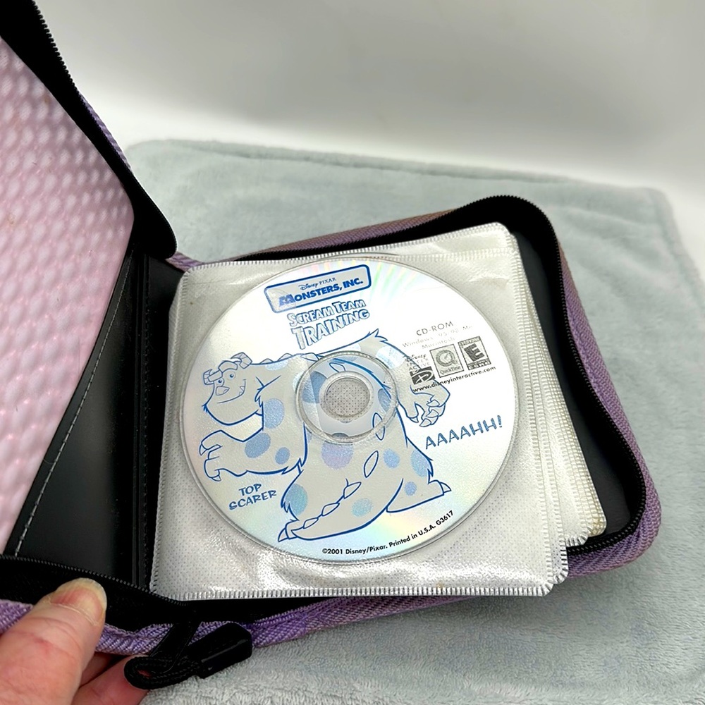 Free with Order of $10. or more CD Zippered Vinyl Case with 12 Asst/Games/Movies